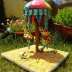 Superb Minions Riding An Umbrella Carousel Cake