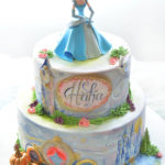Marvelous Two Tier Hand Painted Cinderella Cake With Cinderella Standing on Top