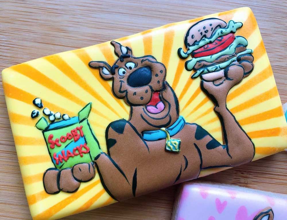 Scooby-Doo eating a burger and Scooby Snacks