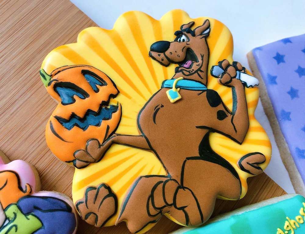 Scooby-Doo carving a pumpkin