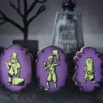 Three glow in the dark cookies each one featuring one hitchhiking ghost