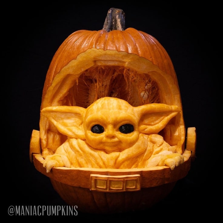3-D pumpkin carving of Baby Yoda in his pram