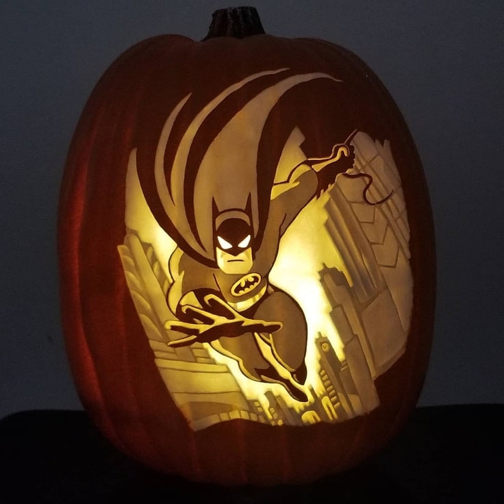 This pumpkin carving has Batman swinging over Gotham City
