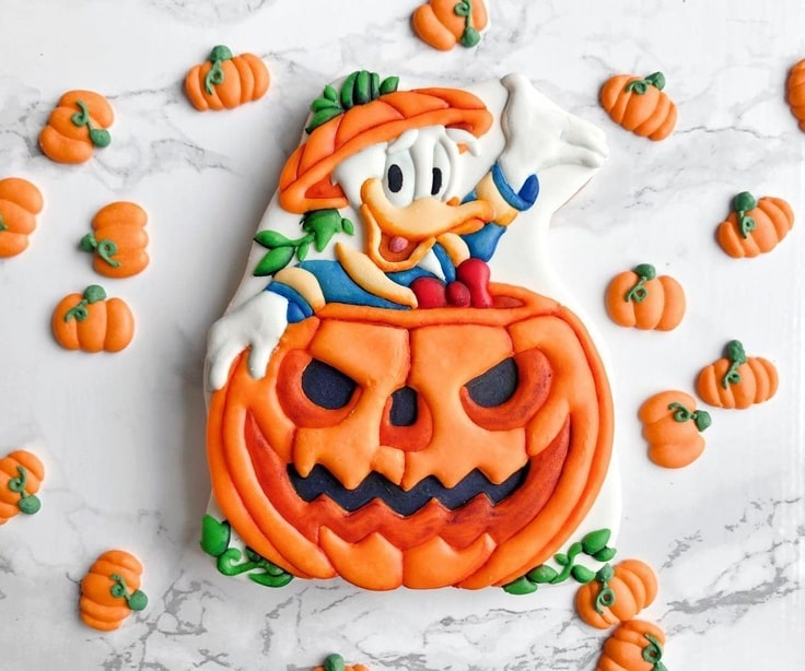 Donald Duck popping out of a pumpkin carving