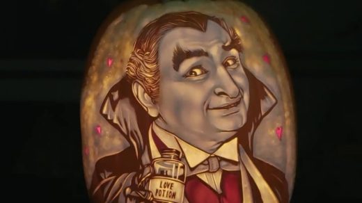 Pumpkin carving of Grandpa Munster holding a love potion