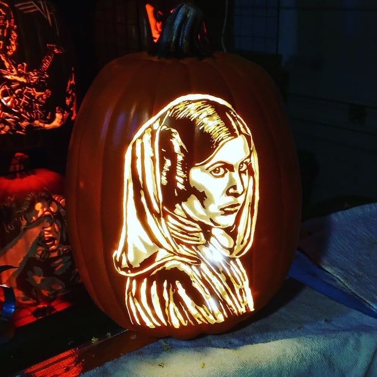Pumpkin carving of Princess Leia wearing her white hooded outfit from A New Hope