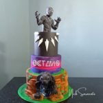 This colorful Black Panther and Wakanda Cake features a Black Panther Cake Topper, Wakanda's night sky and the Panther cave.