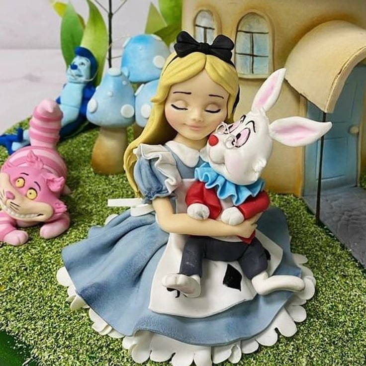 Close-up of Alice hugging the White Rabbit