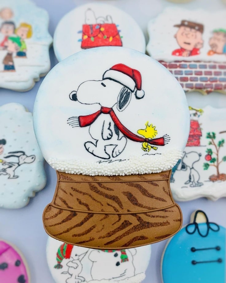 Snow Globe Cookie of Snoopy & Woodstock sharing a scarf