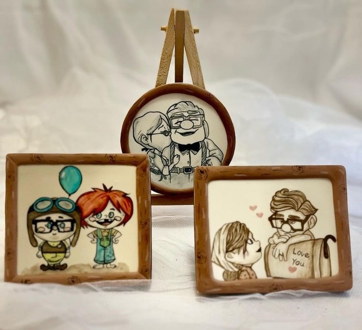 Three portrait cookies of Carl & Ellie from Up