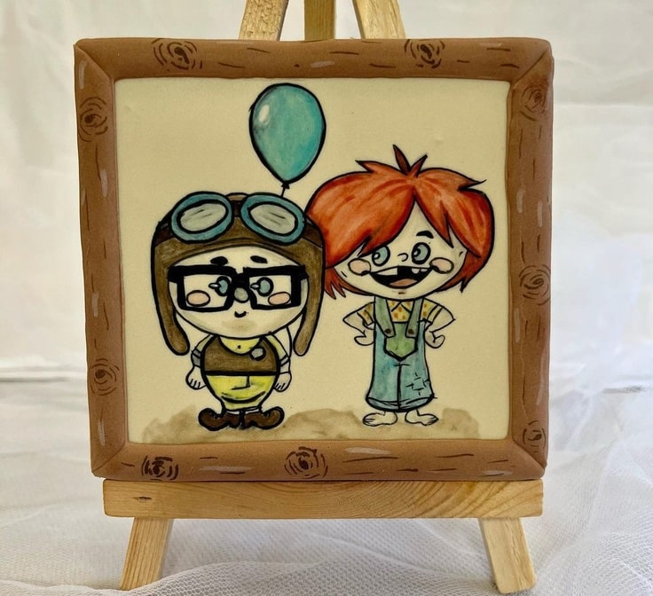 This cookie is a portrait of Carl & Ellie as kids.