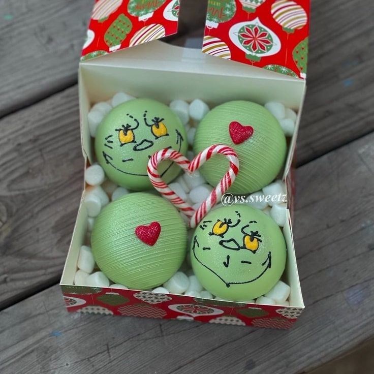 These 4 Grinch Hot Chocolate Bombs include 2 of the Grinch & 2 of his heart being 2 sizes too small.