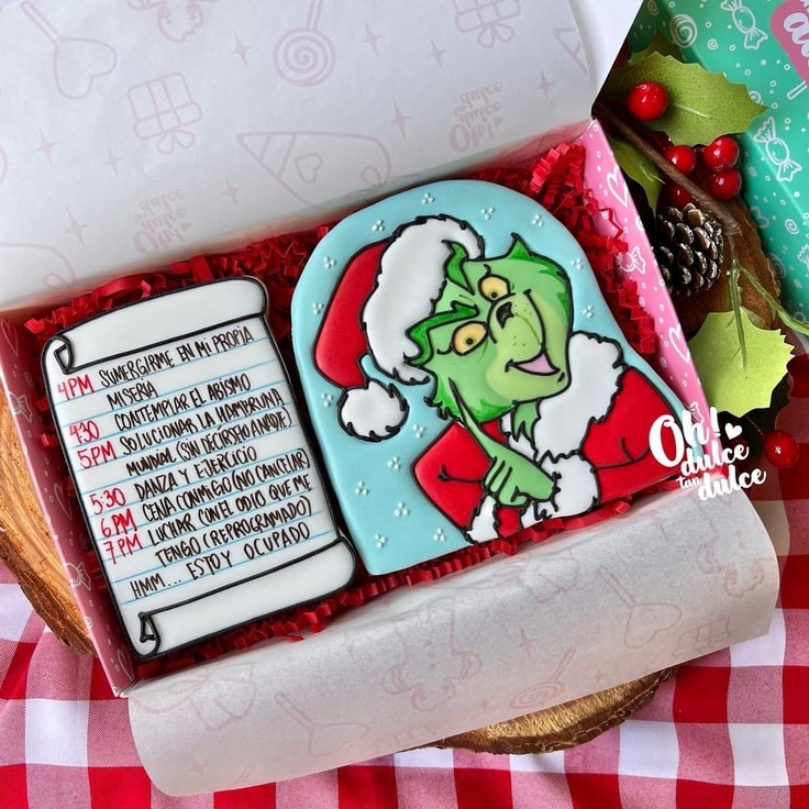 This cook box features two giant cookies - one of the Grinch and the other a cookie of his Christmas schedule