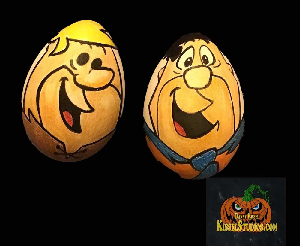 Two hand drawn Easter Eggs of Barney Rubble and Fred Flintstone.
