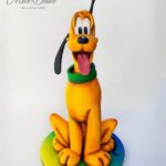Pluto sculpted cake
