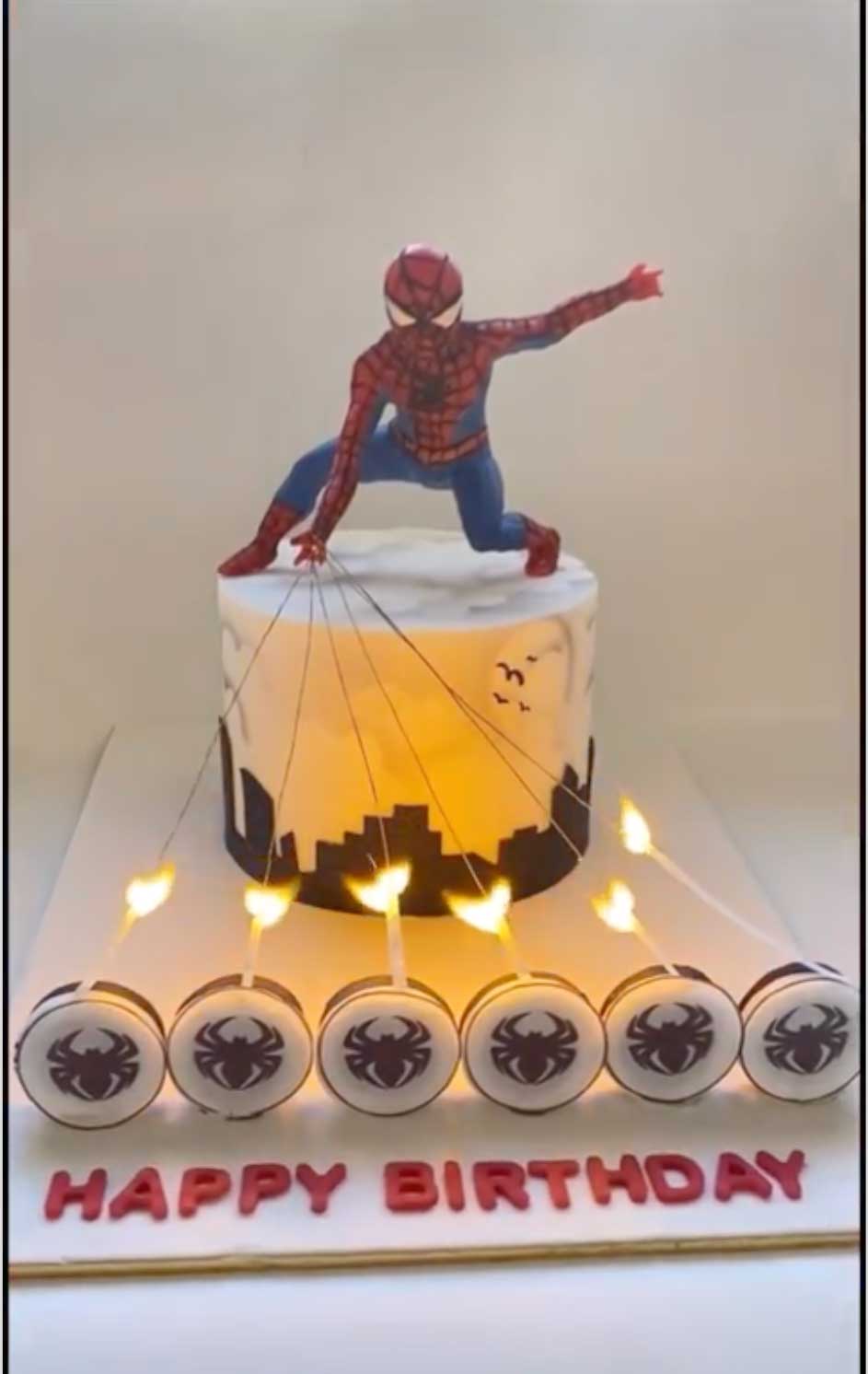 Flaming-Spider-Man-Cake where string covering and candle coverings burn away to reveal birthday name.