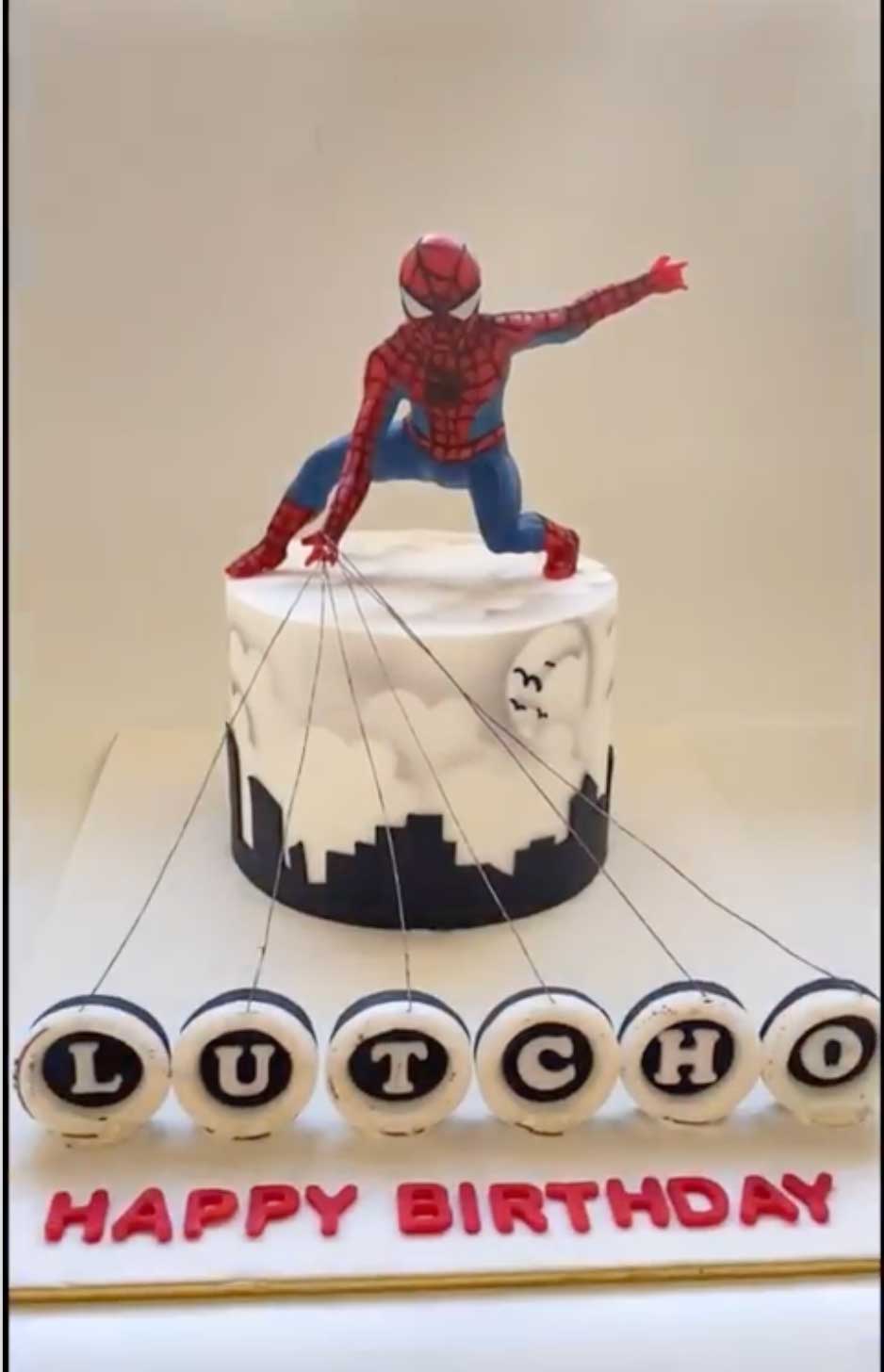 Flaming-Spider-Man-Cake where string covering and candle coverings burn away to reveal birthday name.