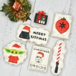A set of six Star Wars Christmas Cookies including Darth Vader, a Stormtrooper and Baby Yoda.