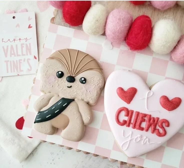 There are two cookies in this Valentine's Day set. The first cookie features a cute Chewbacca cookie. The second cookie is heart shaped and reads "I Chews You".