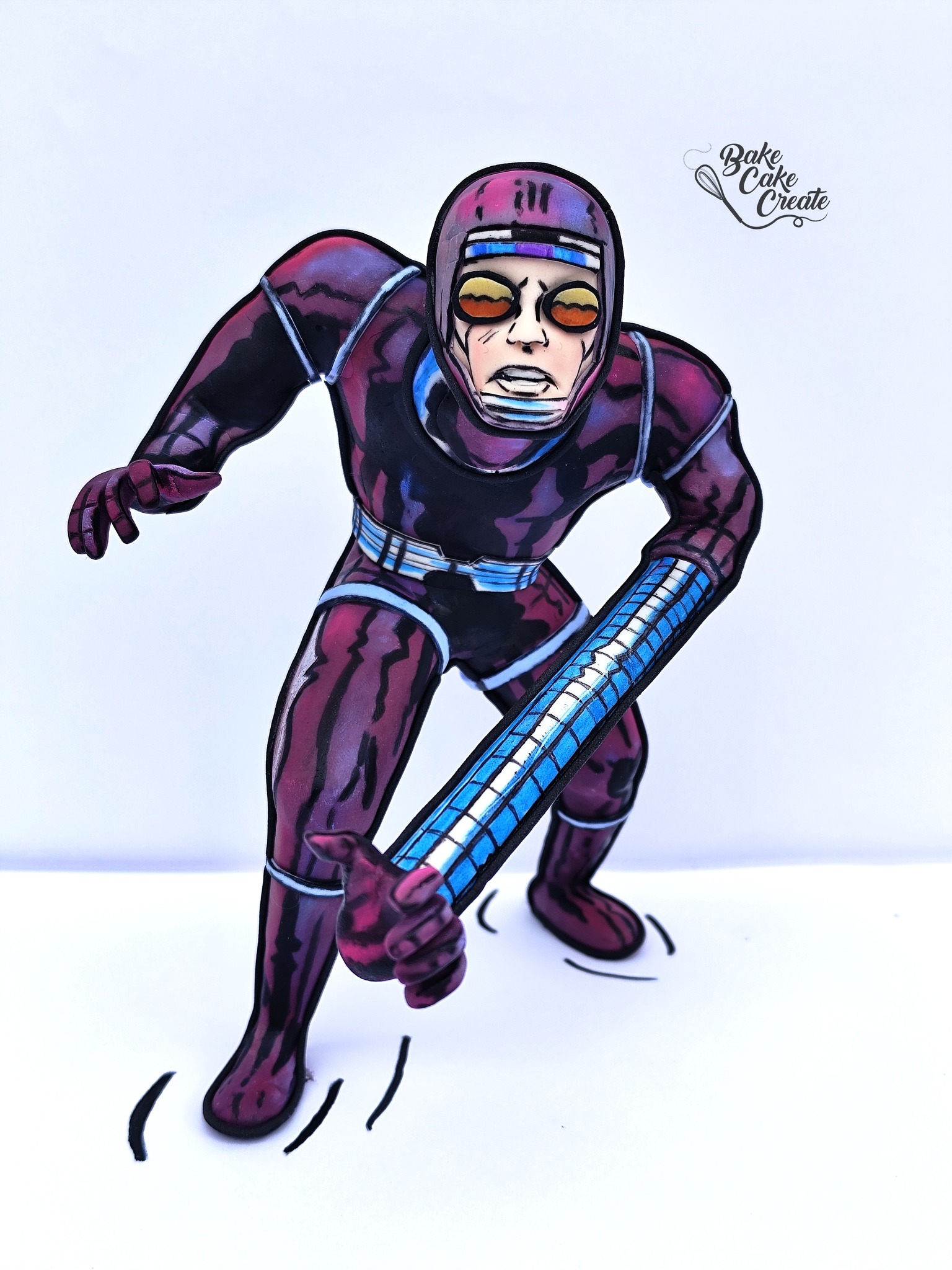 Machine Man is standing up and learning forward. His left arm is stretched so that it is reach towards you.
