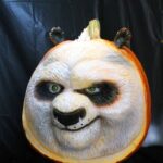This gorgeous Kung Fu Panda pumpkin was carved so that he is 3-D. Then it was painted. His fur is white with black accents.