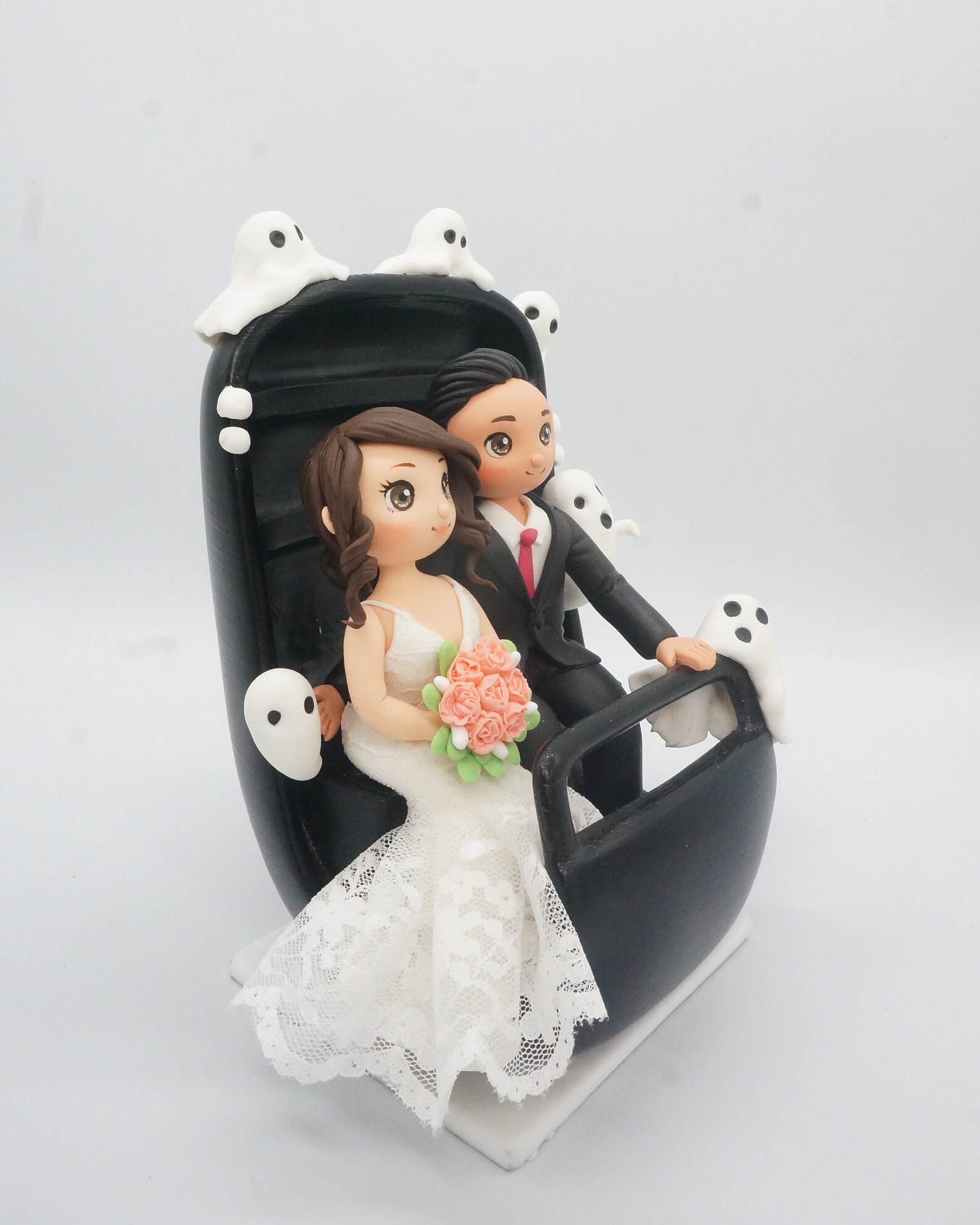 The Bride's side of the Haunted Mansion Wedding Cake Topper