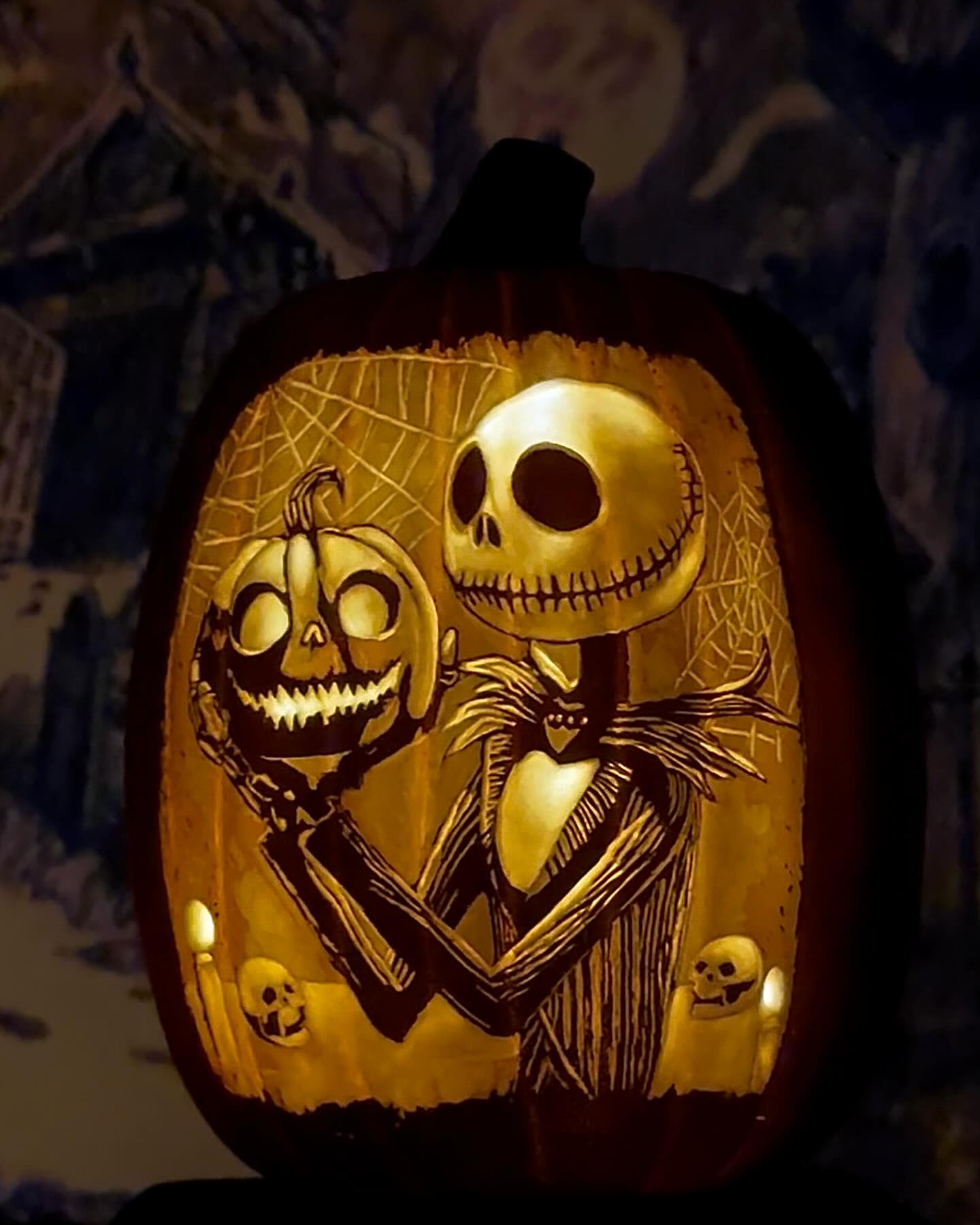 Jack Skellington carving a pumpkin